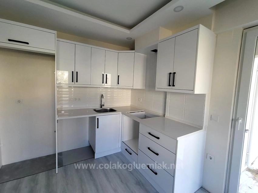 1+1-Apartment Zum Verkauf Im Stadtteil Cumhuriyet, 55 M², Mit Garten, Eingang Im Erdgeschoss.